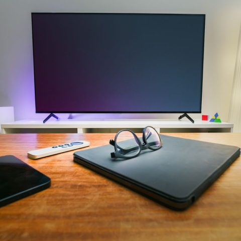 Modern smart TV in a cozy living room with smart devices, available to buy on deposit